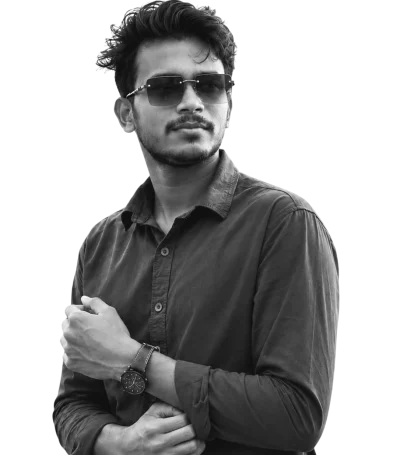 Alt text: Digital marketing specialist in Trivandrum posing in a black shirt and sunglasses against a black background.